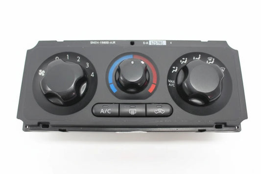 Car air conditioning control panel with dials and buttons on a white background